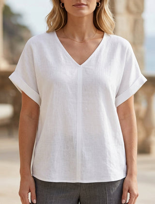 White women's denim summer blouse with V-neck and short sleeves, stylish top by Christine Brewer.