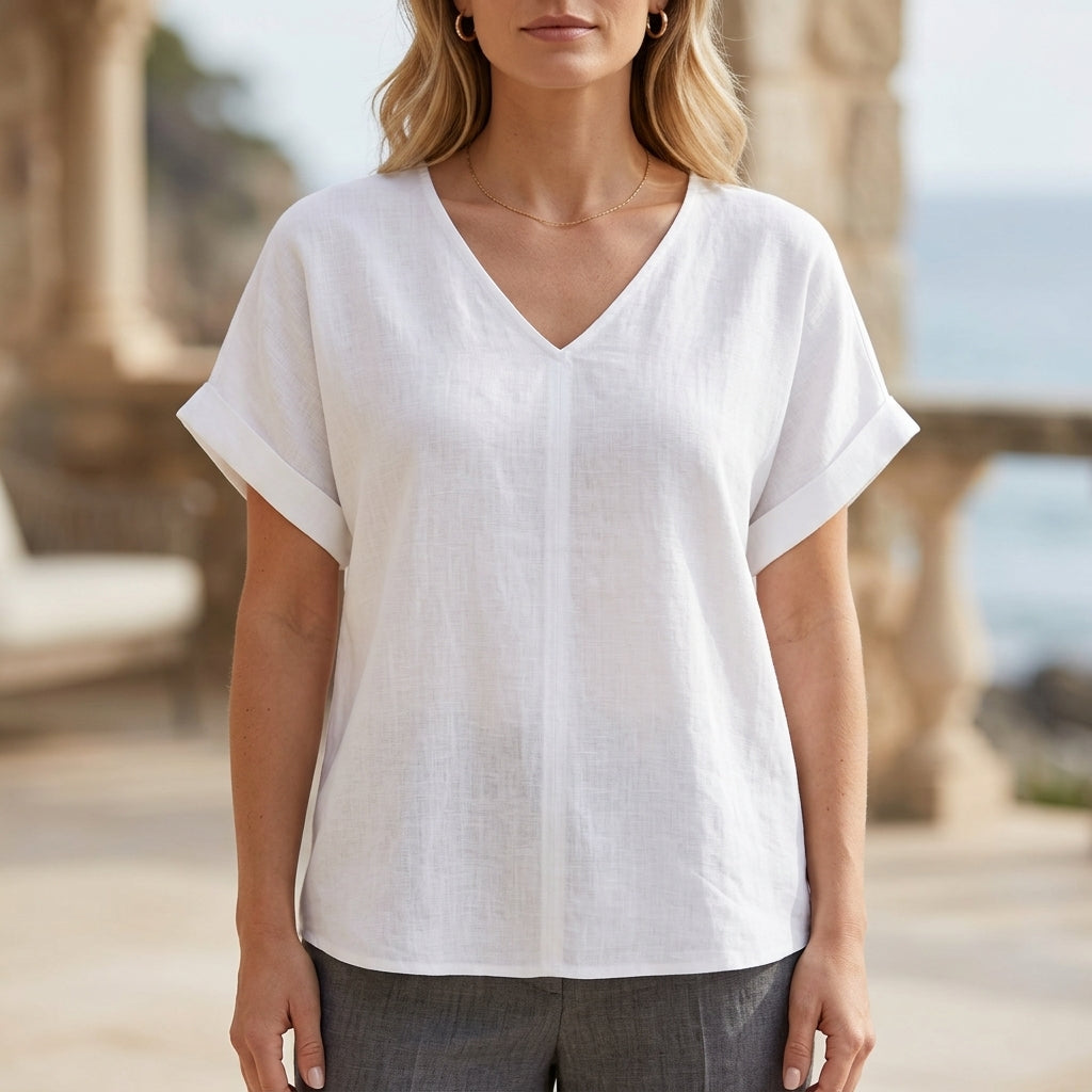 White women's denim summer blouse with V-neck and short sleeves, stylish top by Christine Brewer.