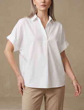 White summer blouse for women by Christine Brewer featuring short sleeves and a denim wide-leg design.