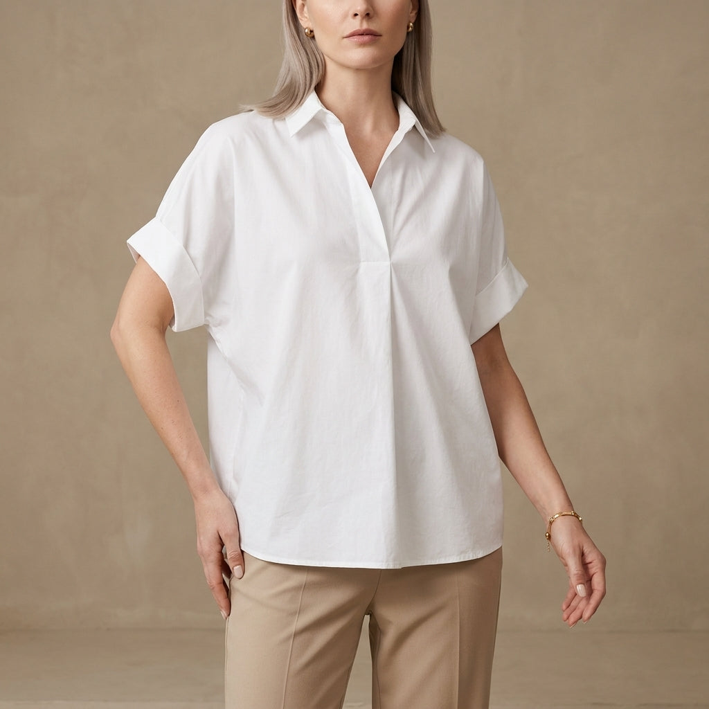 White summer blouse for women by Christine Brewer featuring short sleeves and a denim wide-leg design.