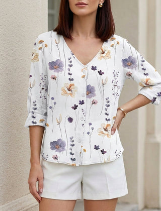 White floral V-neck summer blouse for women with denim button front by Christine Brewer, stylish and lightweight for warm weather.