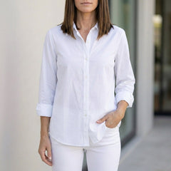 White linen summer blouse for women with button front, designed by Christine Brewer, stylish and breathable top for warm weather.