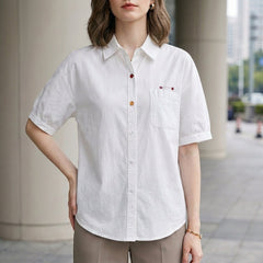 White puff sleeve denim summer blouse for women with button front and casual style by Christine Brewer.