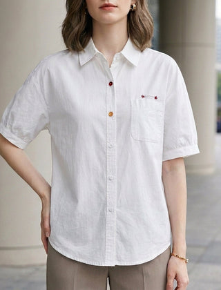 White puff sleeve denim summer blouse for women with button front and casual style by Christine Brewer.