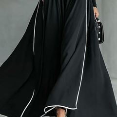 White long sleeve maxi dress for women by Christine Brewer, flowing fabric, fitted bodice, and elegant ankle-length design.