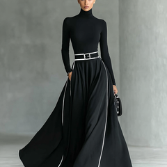 White long sleeve maxi dress for women by Christine Brewer, flowing fabric, fitted waist, and full-length design.