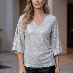 White women's summer blouse with V-neck and sequin details by Christine Brewer, perfect for warm-weather stylish wear.