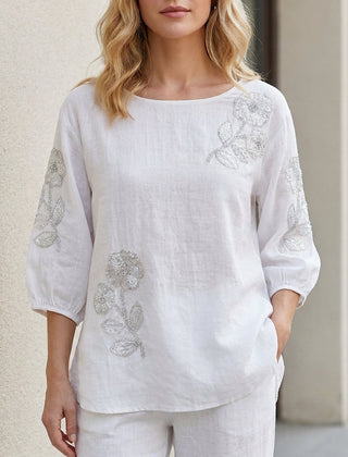 White floral puff sleeve summer blouse for women by Christine Brewer, featuring feminine design and lightweight fabric.