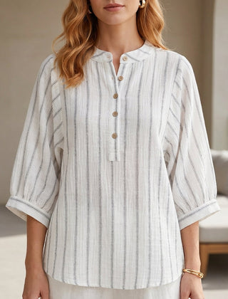 White striped linen summer blouse for women with button front, by Christine Brewer, featuring a relaxed, breathable fit.
