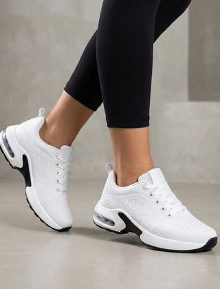 White knit women's sneakers from Christine Brewer, stylish and comfortable women's shoes with a soft, textured fabric design.