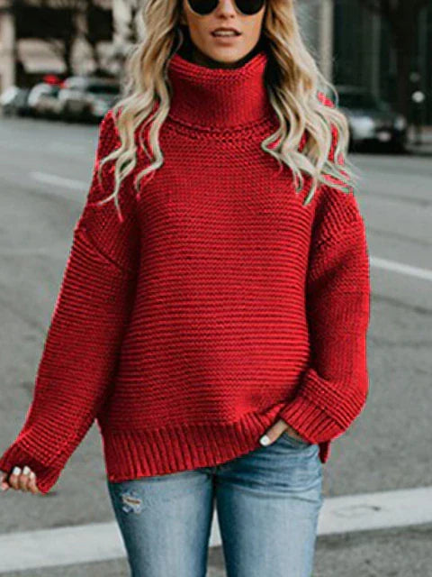 Simone oversized women's turtleneck sweater by Christine Brewer in solid color, featuring a high-neck, long sleeves, and cozy knitted fabric.