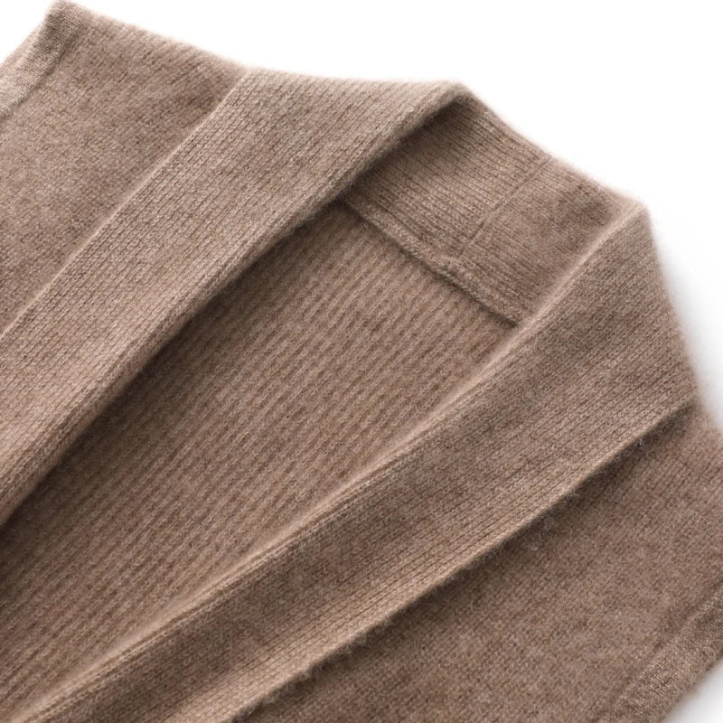 Women wearing Christine Brewer Courtney cashmere wool knit sweater vest with a sleeveless design, lapel collar, and drawstring detail.