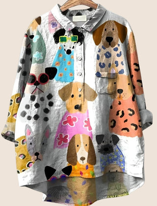 Women wearing the Christine Brewer Harper graphic button-up shirt with a relaxed dog print design.