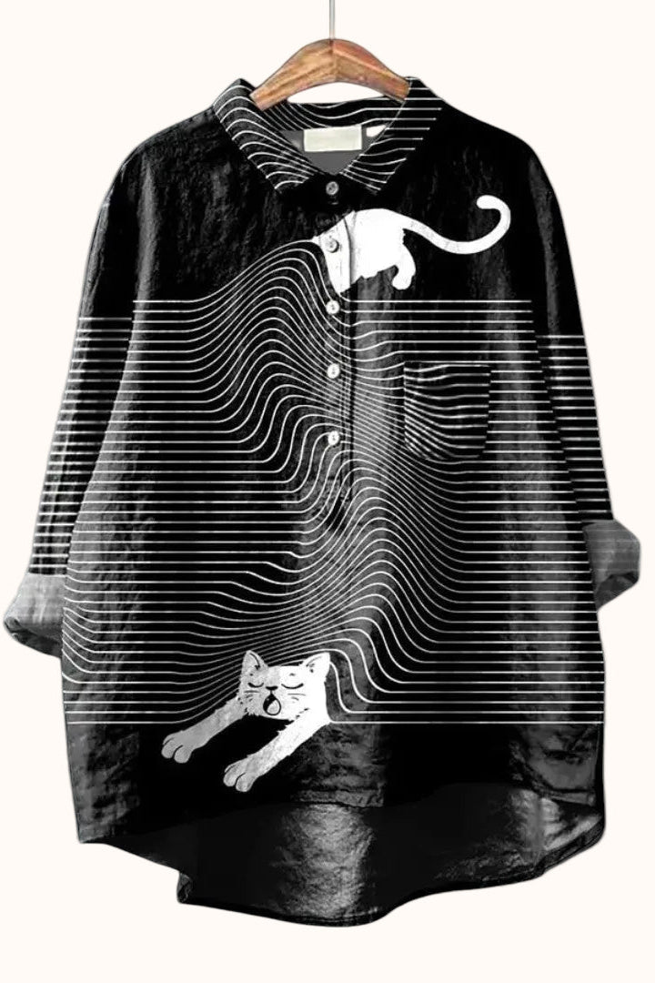 Women wearing the relaxed dog-print graphic button-up shirt by Christine Brewer, showcasing casual style and playful design.
