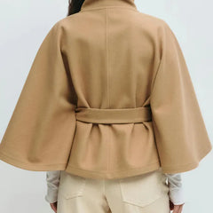 Women’s spring belted high-neck cape coat with funnel neck and long sleeves, in a stylish design by Christine Brewer.
