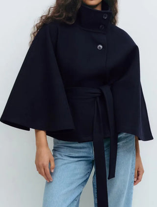 Women's high-neck belted cape coat with short sleeves and funnel neck design by Christine Brewer, perfect for spring.