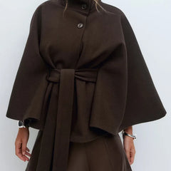 Daisy women's spring belted high-neck cape coat by Christine Brewer, featuring a funnel neckline, belted waist, and cape sleeves.