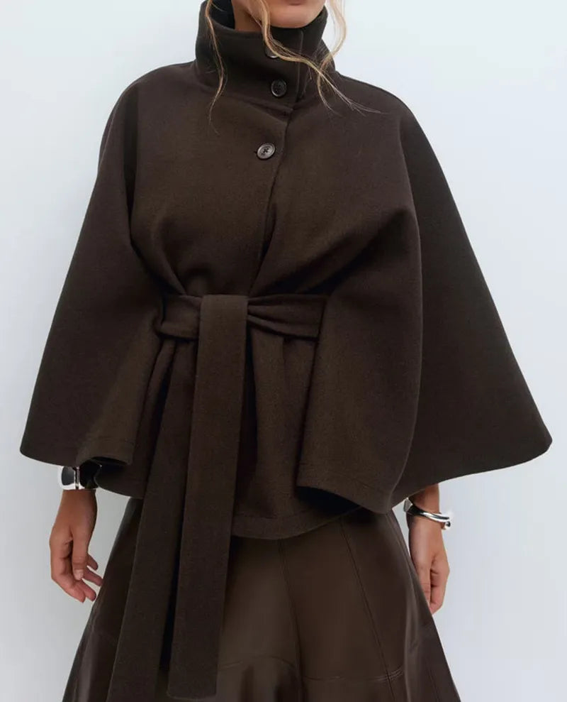 Daisy women's spring belted high-neck cape coat by Christine Brewer, featuring a funnel neckline, belted waist, and cape sleeves.