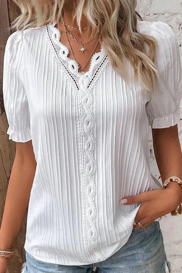 White V-neck blouse for women with puff sleeves by Christine Brewer, showcasing a stylish, fitted design.