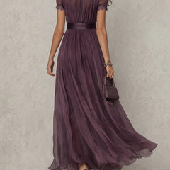 Elegant mini bodycon dress for women by Christine Brewer, made of chiffon fabric, shown in a stylish fit and flowy design.