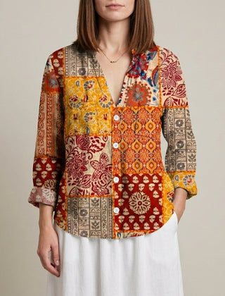 Yellow floral V-neck long sleeve linen blouse for women by Christine Brewer, showing the lightweight, stylish top.
