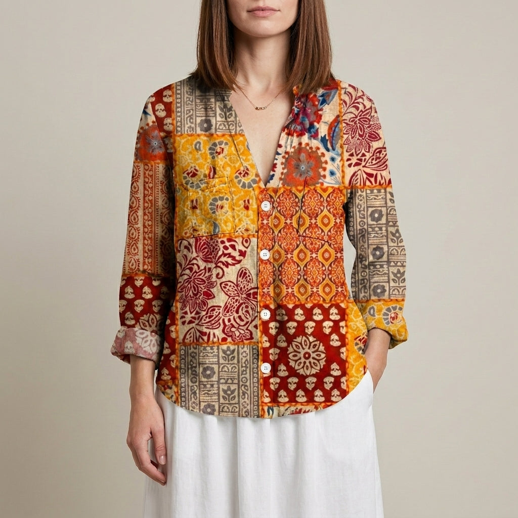 Yellow floral V-neck long sleeve linen blouse for women by Christine Brewer, showing the lightweight, stylish top.