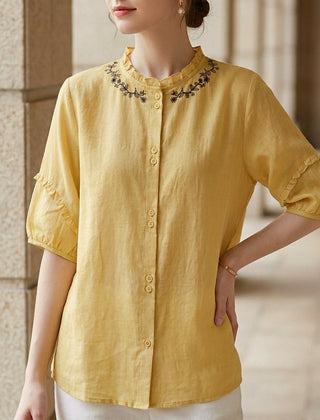Yellow linen ruffle summer blouse for women by Christine Brewer, featuring a lightweight, stylish top with ruffle details.