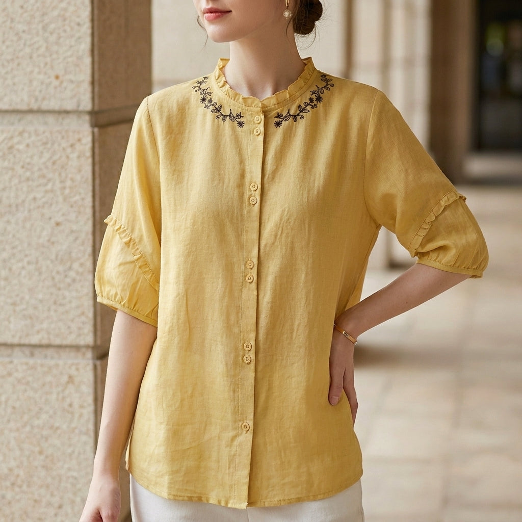 Yellow linen ruffle summer blouse for women by Christine Brewer, featuring a lightweight, stylish top with ruffle details.