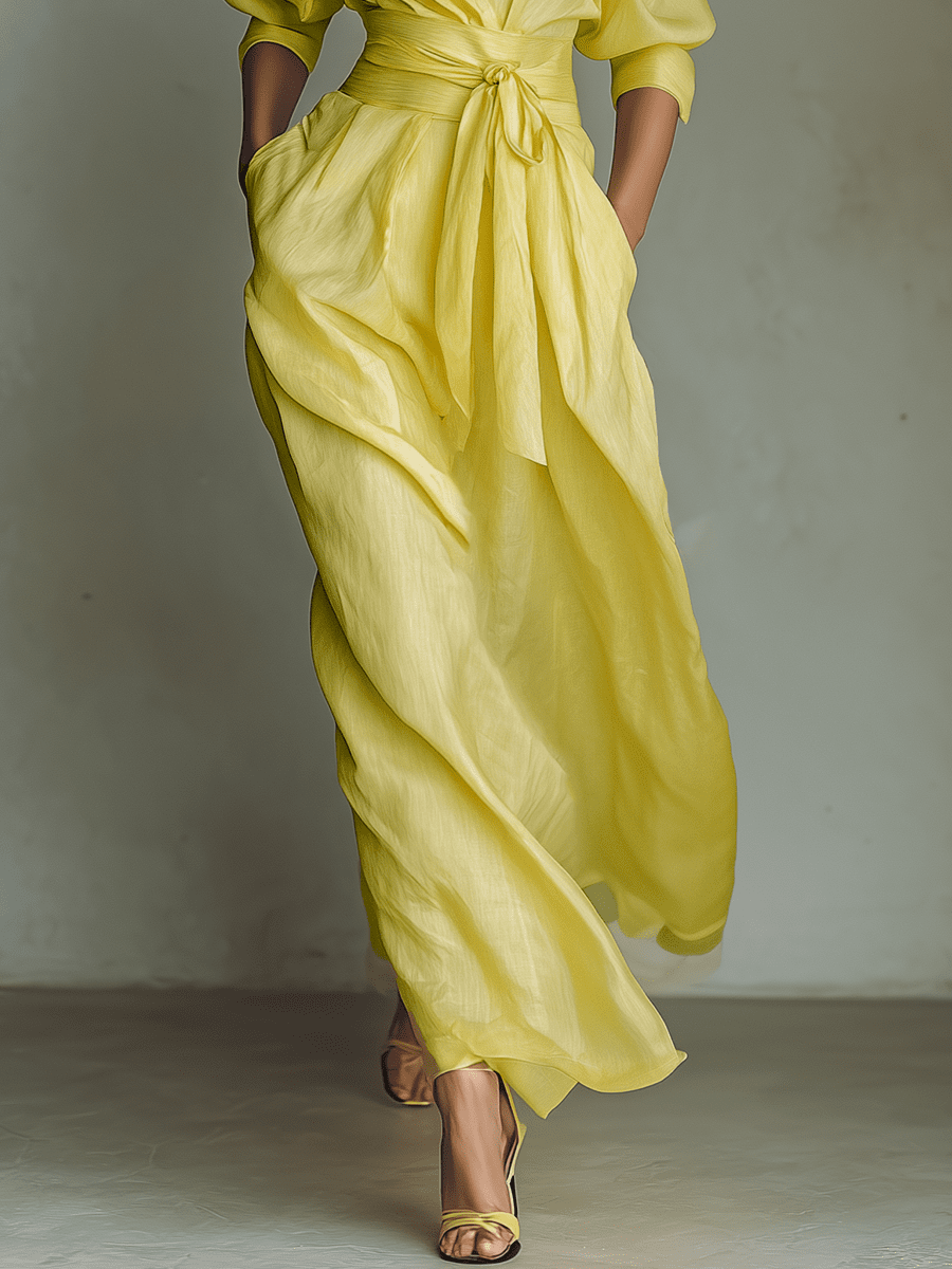 Yellow linen maxi dress for women by Christine Brewer, flowing sleeveless design with a fitted waist and ankle-length hem.