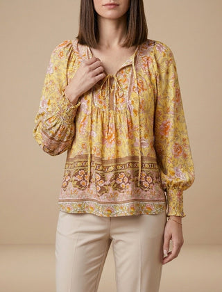 Yellow floral long sleeve linen blouse for women by Christine Brewer, showing the lightweight, casual summer top with a relaxed fit.