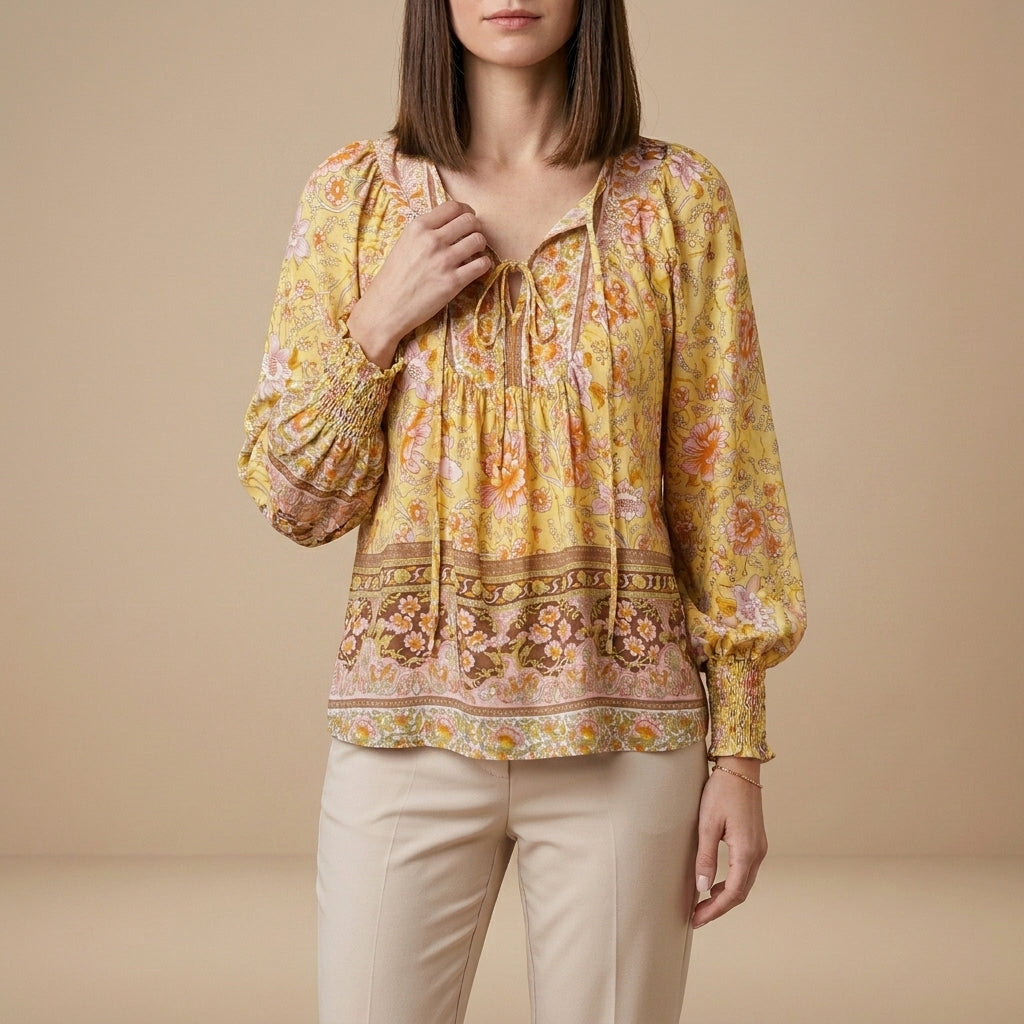 Yellow floral long sleeve linen blouse for women by Christine Brewer, showing the lightweight, casual summer top with a relaxed fit.