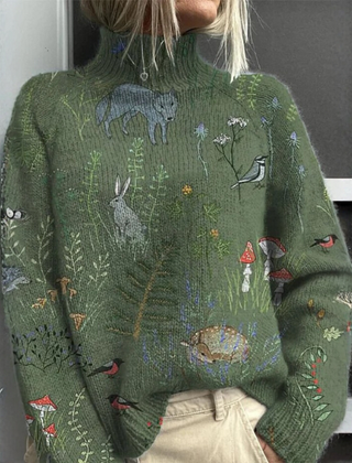 Emery women's floral turtleneck sweater by Christine Brewer, featuring a cozy knit with colorful flower patterns.