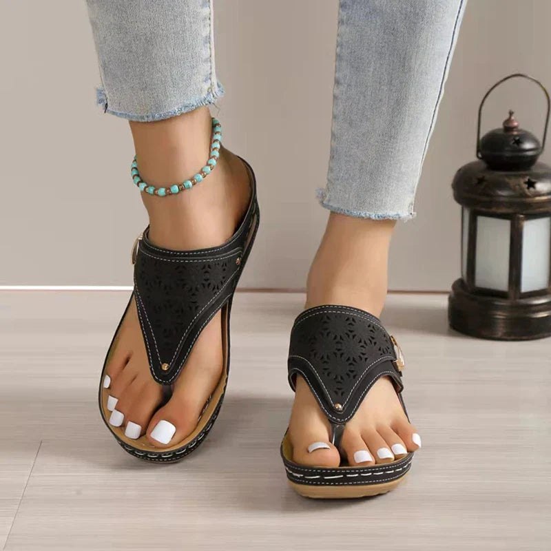 Laser-cut thong wedge sandals for women by Christine Brewer with orthopedic support, soft insole, and anti-slip sole.