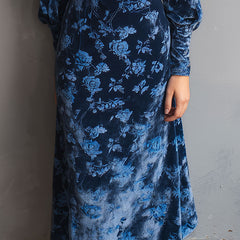 Retro rose-print velvet turtleneck midi dress by Christine Brewer displayed on a hanger showing its floral pattern and elegant silhouette.