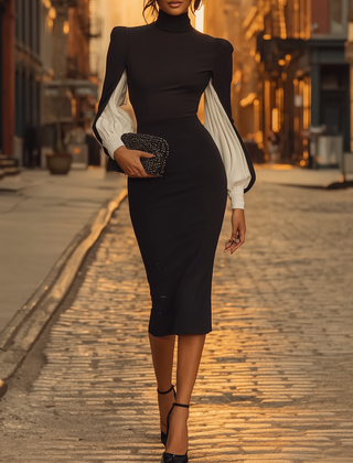 White midi dress for women by Christine Brewer, featuring a flowing fabric and elegant design, shown on a model.