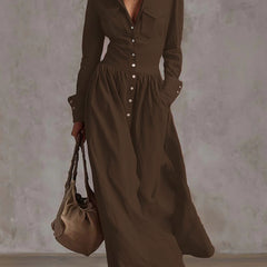 Christine Brewer high waisted long sleeve maxi dress with pleated pockets, button details, solid color, and split-joint lapel.