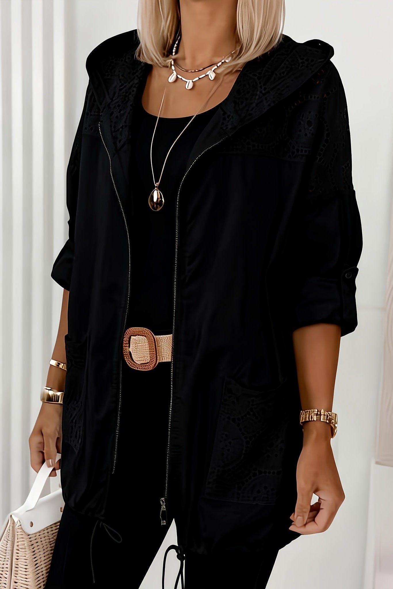 Women’s Iris hooded jacket by Christine Brewer, featuring a stylish design with a zip front and adjustable hood.