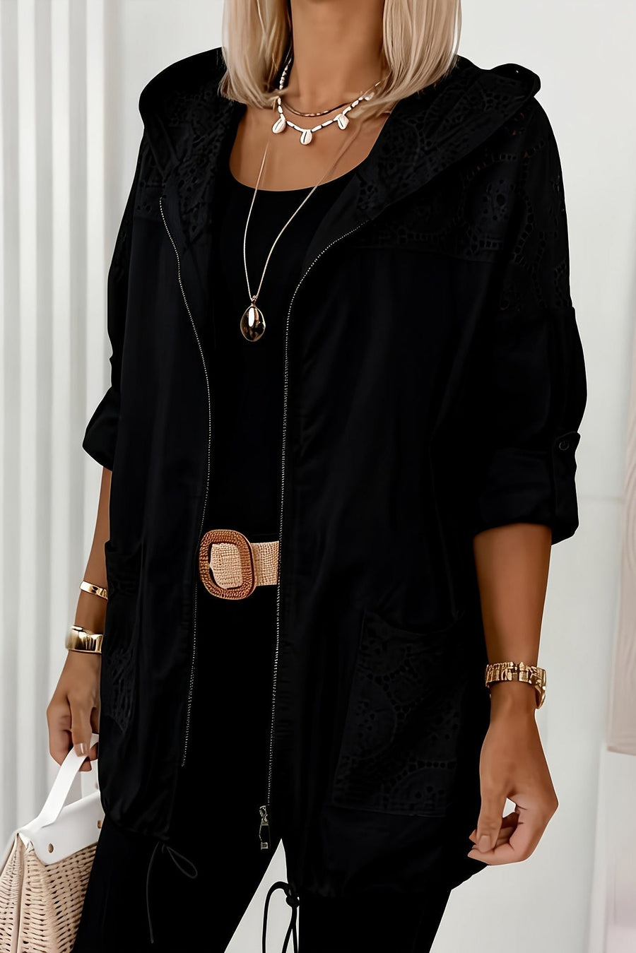 Women’s Iris hooded jacket by Christine Brewer, featuring a stylish design with a zip front and adjustable hood.