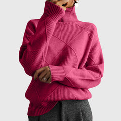 Cream-colored Laura turtleneck sweater for women by Christine Brewer, featuring a cozy, fitted design and ribbed collar.