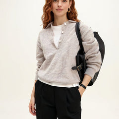 Women's wool hoodie sweater by Christine Brewer featuring a cozy, knit design with a hood and long sleeves in neutral tones.