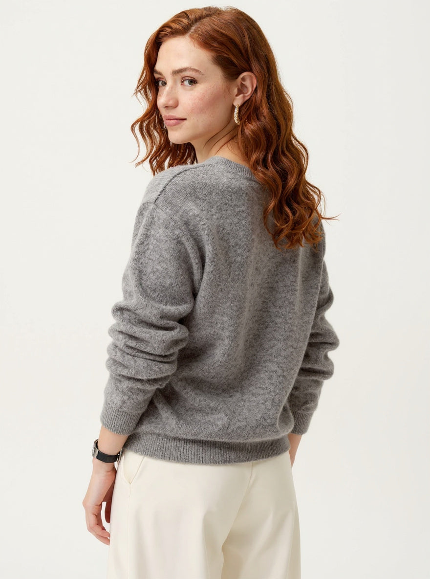 Women's wool hoodie sweater by Christine Brewer, featuring a cozy fit and stylish design in soft, warm wool fabric.