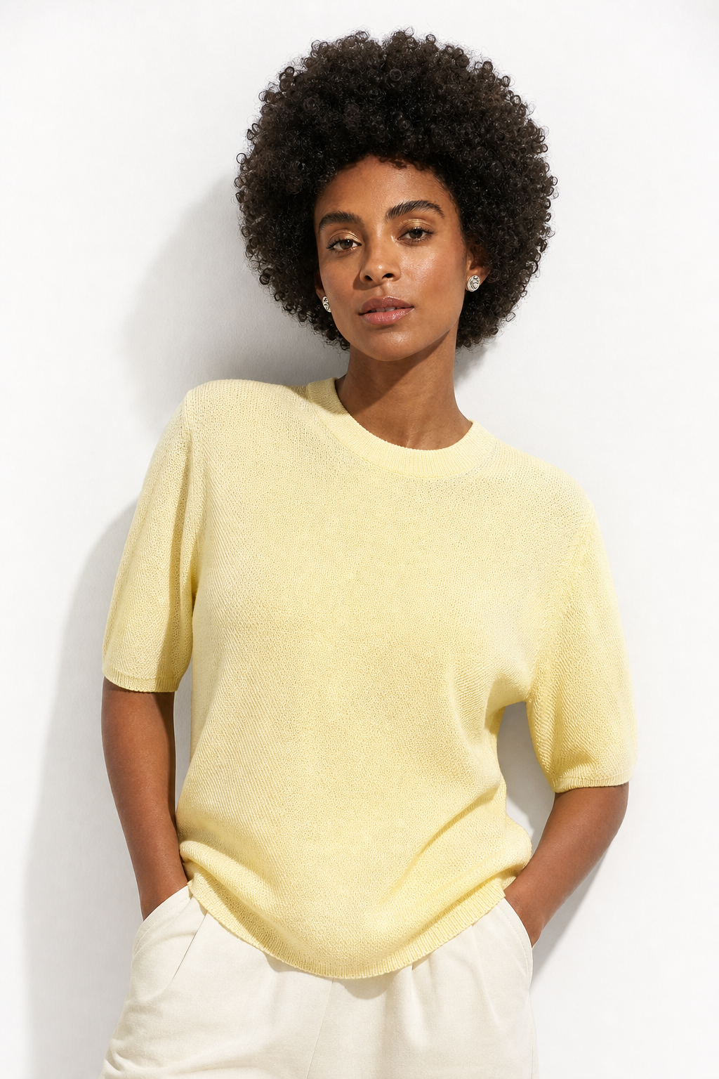 Wool sweater for women in beige with ribbed cuffs and neckline, by Christine Brewer, featuring a cozy, stylish fit.