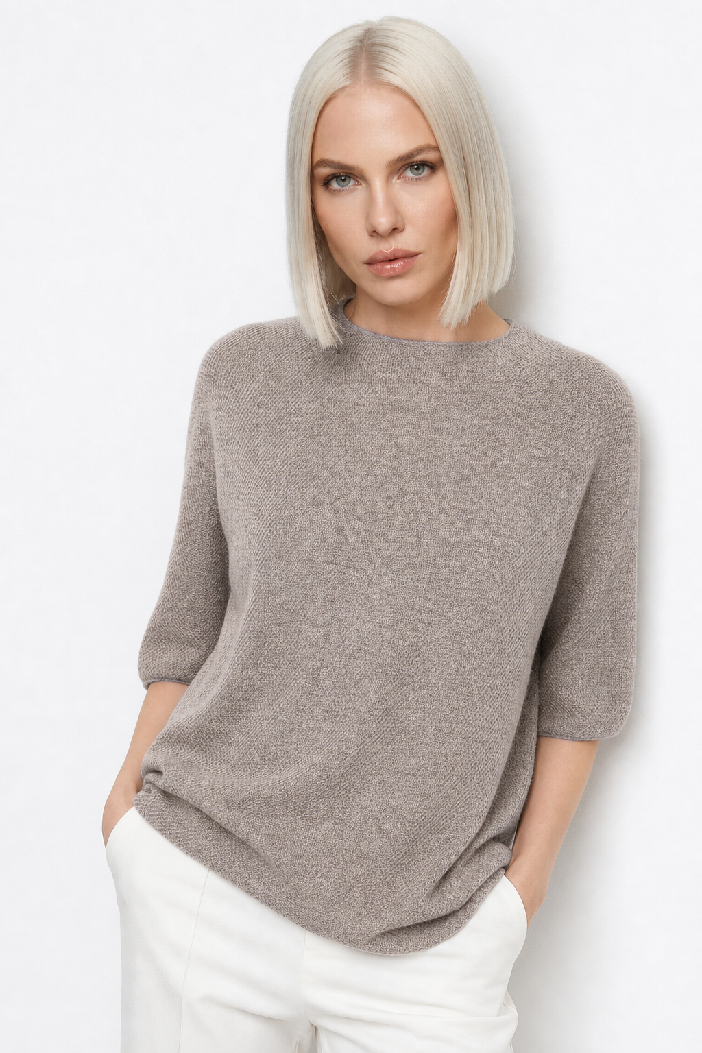 Pink wool sweater for women by Christine Brewer, featuring a cozy, classic fit with a ribbed collar and cuffs.