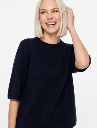 Cream-colored Frankie wool sweater for women by Christine Brewer, featuring a cozy, textured knit design.