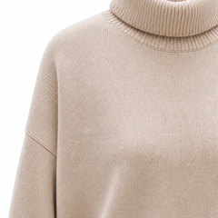 Cream-colored Erica oversized turtleneck sweater for women by Christine Brewer, featuring a cozy fit and knit texture.