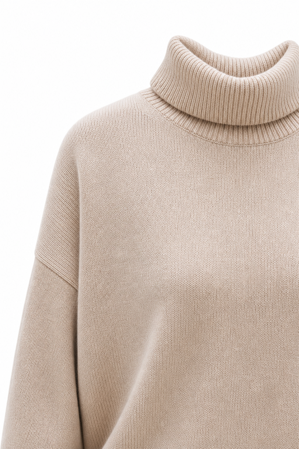 Cream-colored Erica oversized turtleneck sweater for women by Christine Brewer, featuring a cozy fit and knit texture.