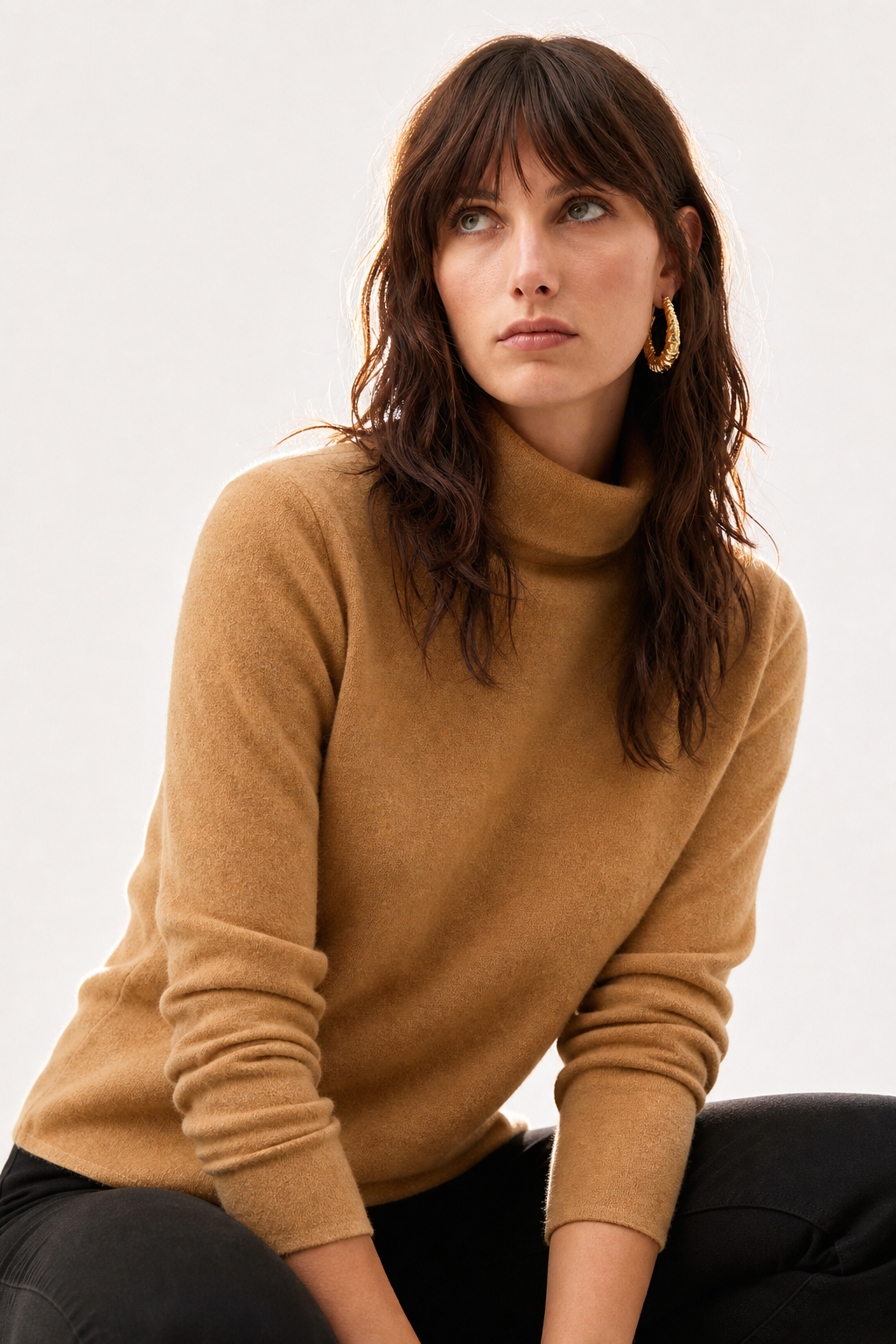 Cream-colored Christine Brewer Gabrielle cashmere turtleneck sweater for women, featuring a cozy fit and classic design.