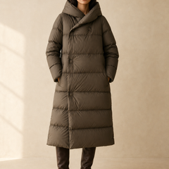 Long hooded parka for women by Christine Brewer, featuring a stylish design and warm, functional outerwear for cold weather.