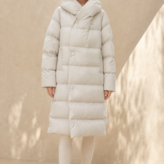 Long hooded women's parka from Christine Brewer, featuring a stylish design and warm, practical hooded outerwear.