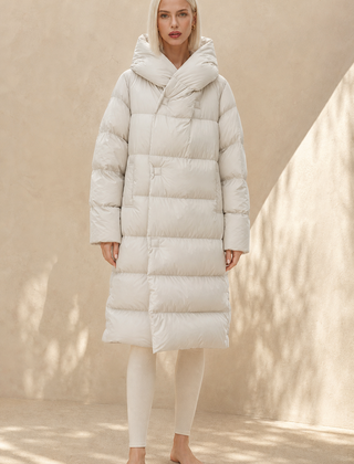 Long hooded women's parka from Christine Brewer, featuring a stylish design and warm, practical hooded outerwear.